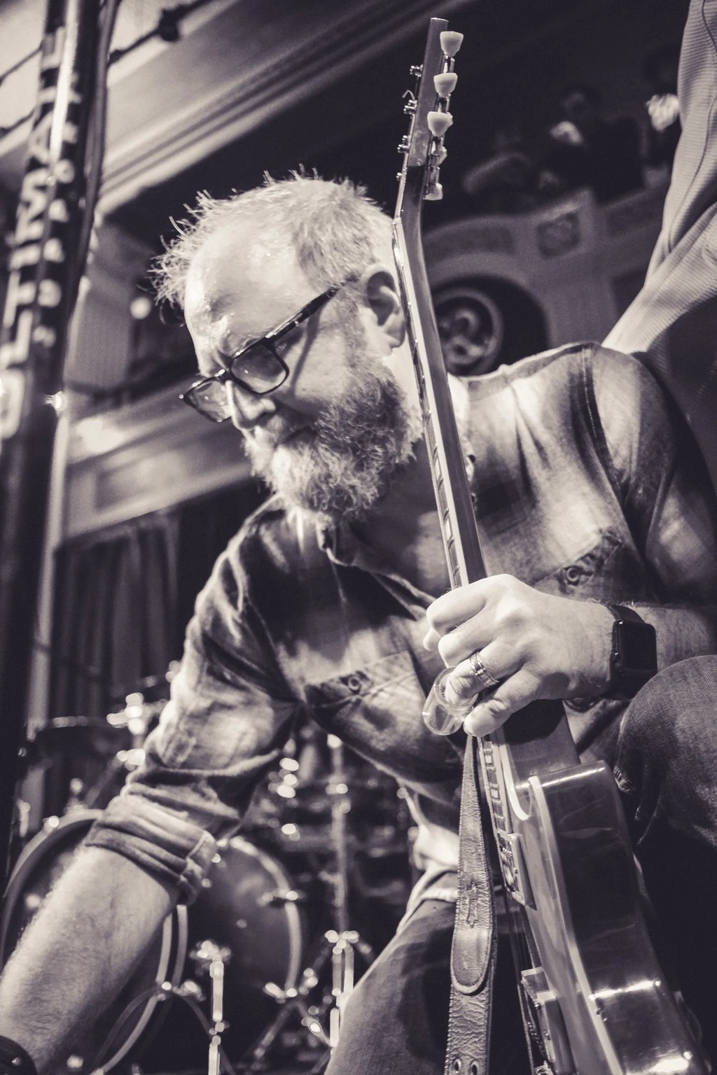 Eric Jarvis playing guitar during a performance