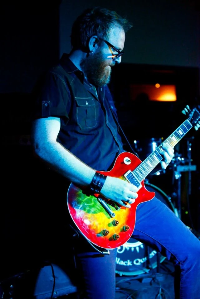 Eric Jarvis performing live on electric guitar